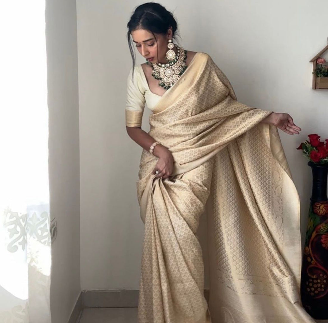 Cream Color Banarasi Silk Silver Zari Weaving And Traditional Motifs Ready To Wear Saree With Unstitched Blouse