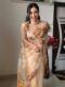 Pastel Beige Shade With Brown And Mustard Floral Prints Organza Ready To Wear Saree With Unstitched Blouse