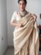 Cream Color Banarasi Silk Silver Zari Weaving And Traditional Motifs Ready To Wear Saree With Unstitched Blouse