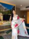 White Shade, Adorned With Large Red And Yellow Floral Prints Georgette Ready To Wear Saree With Unstitched Blouse