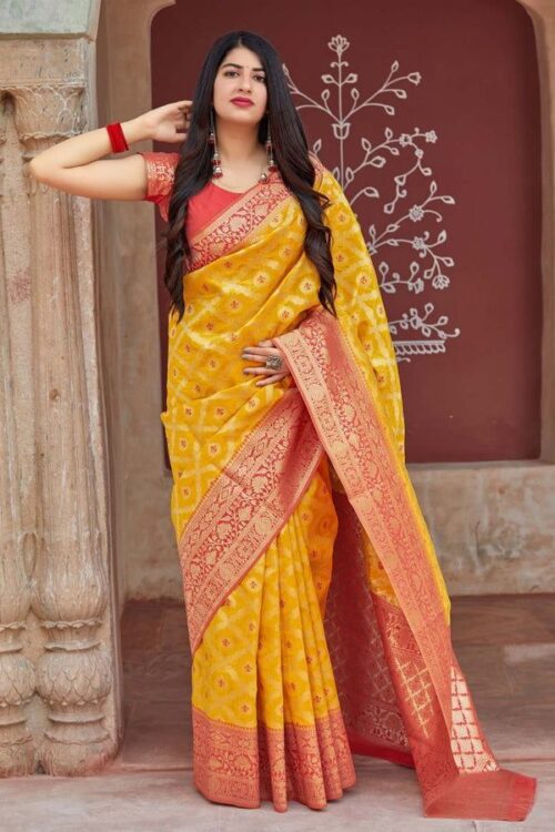 Radiant Yellow Banarasi Silk Saree with Red Zari Border – A Classic Blend of Tradition and Vibrance